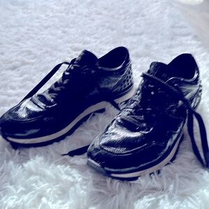 Tod’s Black sneakers — about 5 years old, good condition.